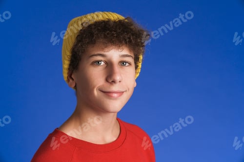 Preview: White boy wearing hat smiling and looking at camera