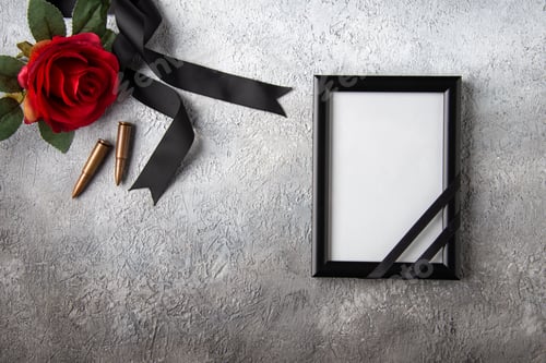 Preview: top view of picture frame with red flower and bullets on a white background death tank war