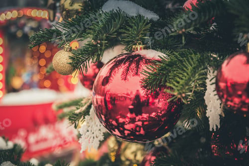 Preview: Decorated Christmas tree with red balls, garland. Outdoor fair. Xmas .