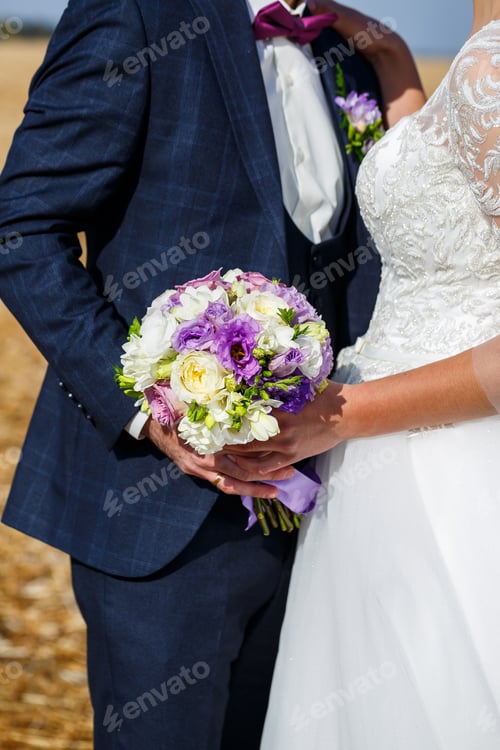 Preview: Bride and groom hugging on a wedding day