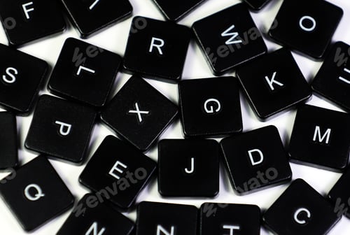 Preview: High angle shot of mixed black letter keys isolated on white ckground