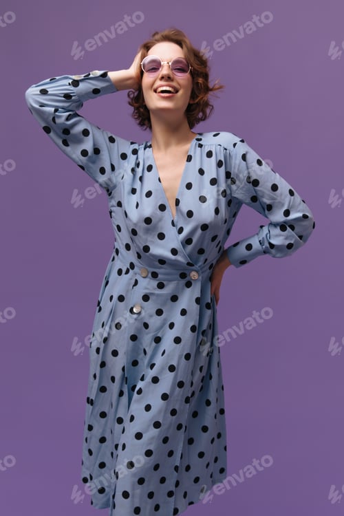 Preview: Joyful lady standing isolated over purple background. Cute stylish girl with short ginger hairstyle