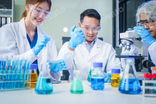 Preview: Two Asian men and women sit at a table in a laboratory, conducting research on liquids. They use