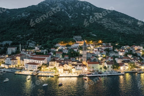 Preview: Coast of Perast in the sparkle of illumination at night. Montenegro. Drone