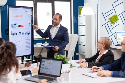 Preview: Business partner presenting company strategy to diverse team