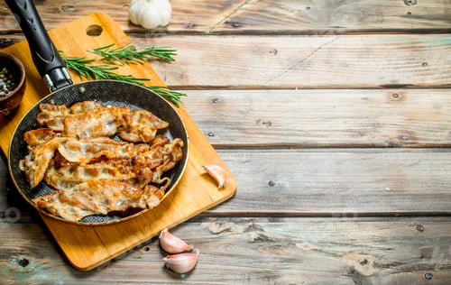 Preview: Fried bacon with garlic and spices.