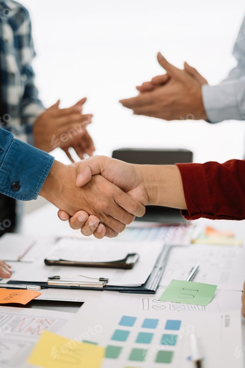 Preview: designer team shake hands confidently professional investor working with new startup project
