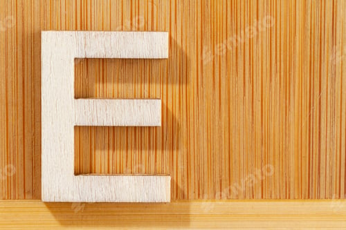 Preview: Letter E of wood-made alphabet, top view and space for text