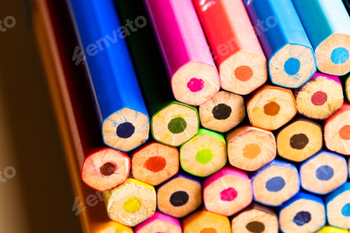 Preview: Close up of multi coloured pencils and copy space on orange background