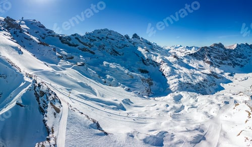 Preview: Aerial panoramic winter landscape in Swiss Alps, famous Engelgerg - Titlis ski resort, Switzerland