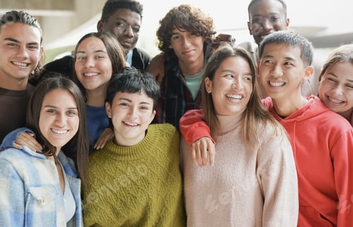 Preview: Diverse young students hugging each other outdoor of school building