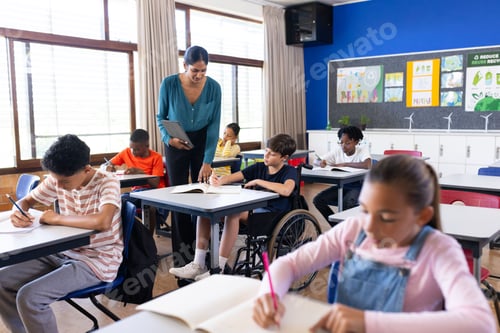 Preview: Indian female teacher assisting students in classroom, diverse group studying in school