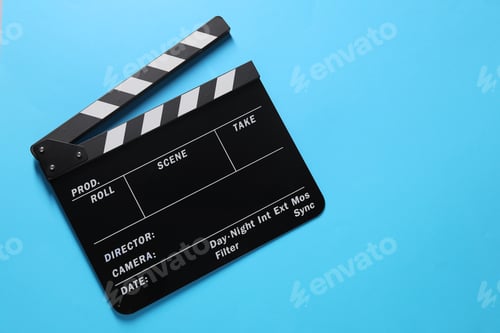 Preview: Clapperboard on light blue background, top view. Space for text