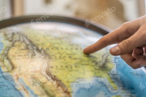 Preview: persons finger point at globe and choose destination b