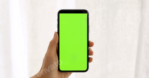 Preview: Female hand hold smartphone greeen screen