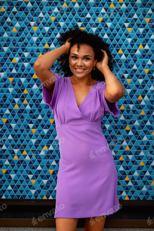 Preview: beautiful girl in a dress on a colored background