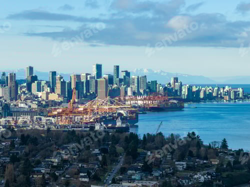 Preview: Vancouver Skyline With Port Cranes Over Water and Mountain Backdrop, A Coastal Cityscape