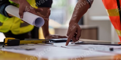 Preview: Architect and Engineer working with blueprints for architectural plan, engineer sketching a