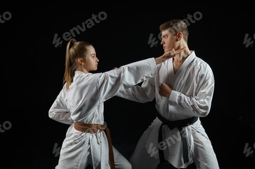 Preview: Female karate fighter on training with master