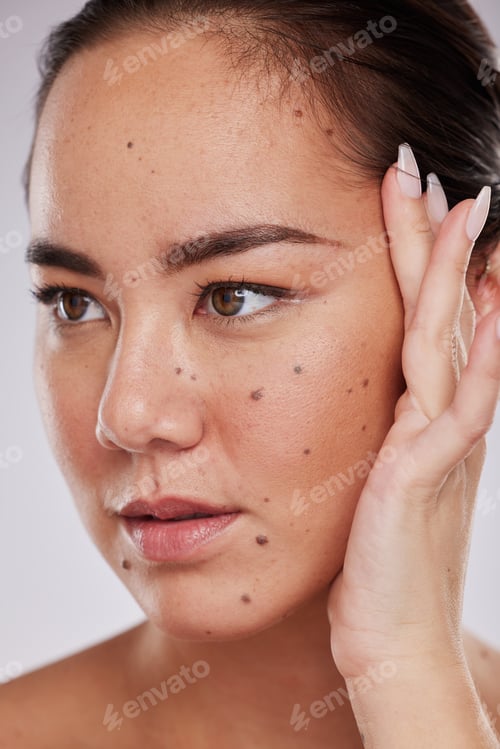 Preview: Beauty, hand on face and woman in studio for skincare, dermatology and cosmetics for skin glow. Aes