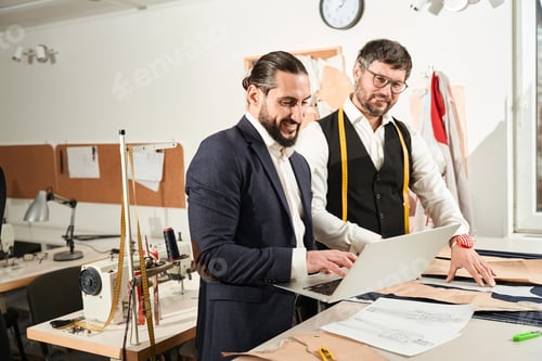 Preview: Tailors Collaborating on Design with Laptop