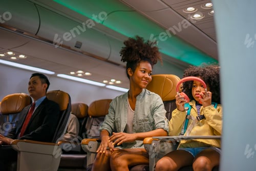 Preview: Passengers are sitting in the passenger cabin while travel by commercial air plane.
