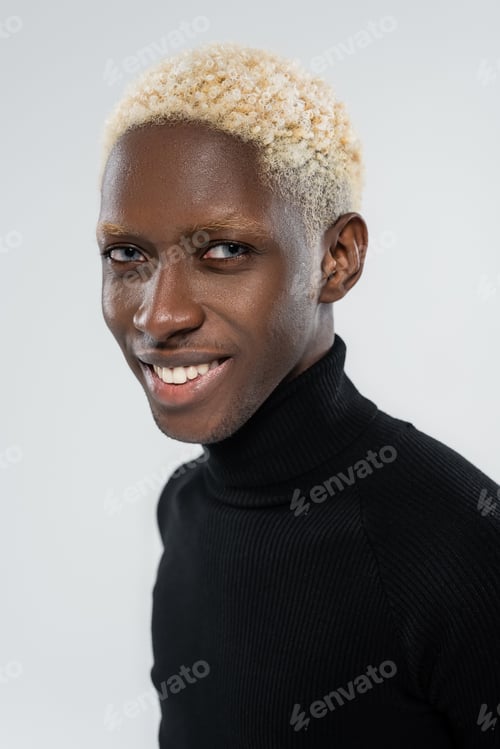 Preview: portrait of cheerful african american man with blue eyes isolated on grey