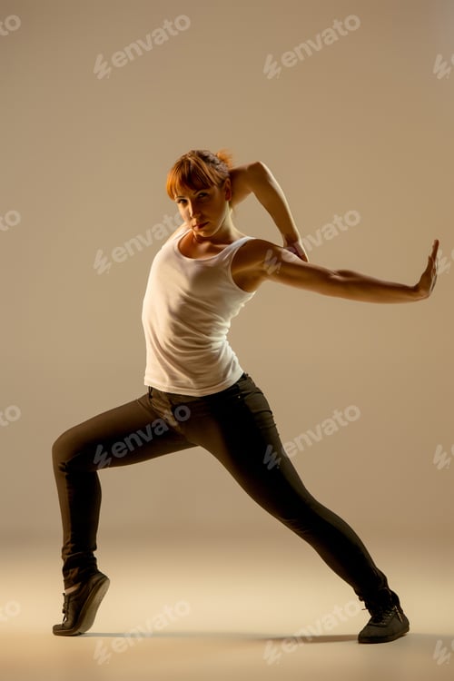 Preview: The Women Dancing Fitness Or Hip Hop Choreography In Beige Studio Background