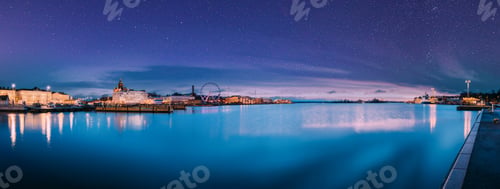 Preview: Helsinki, Finland. Light Blue Dramatic Sky With Shining Stars. View Of Embankment With Ferris Wheel