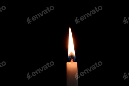 Preview: Wax candle burning on black background