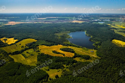 Preview: Top view of Bolta lake in the forest in the Braslav lakes National Park at dawn, the most beautiful