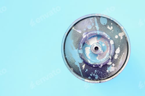 Preview: Used spray can with blue paint drips lie on texture background of fashion pastel blue color paper