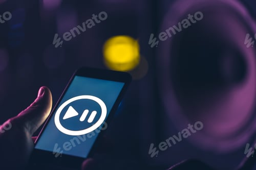 Preview: Phone with music listening icon on screen on dark background, copy space.