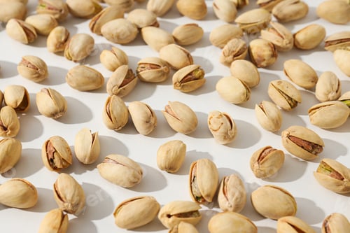 Preview: Pistachios in the shell, on a light background.