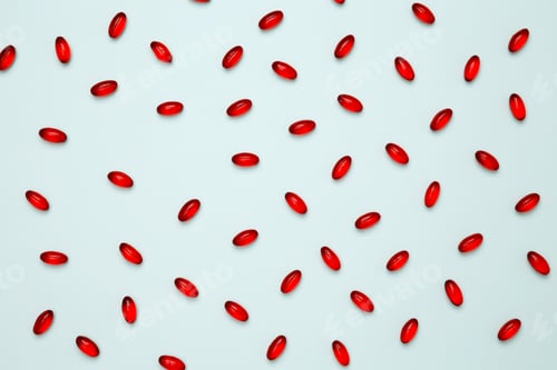 Preview: Red pills and capsules scattered. Concept of medicine, healthcare, and pharmaceutical industry