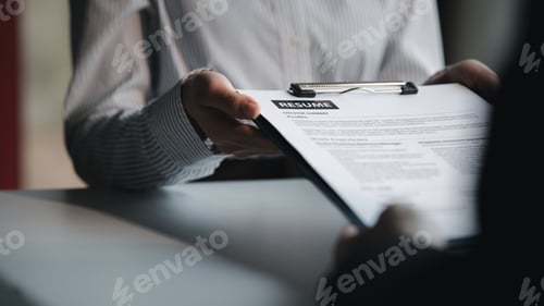 Preview: The HR department is reviewing the resumes of job applicants.