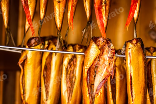 Preview: Closeup of smoked fish in smokehouse
