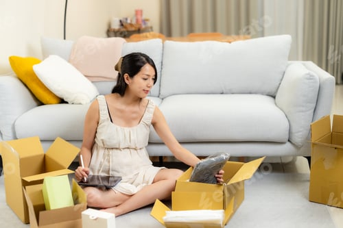 Preview: Pregnant mum do online business at home with pack up the product for shipping