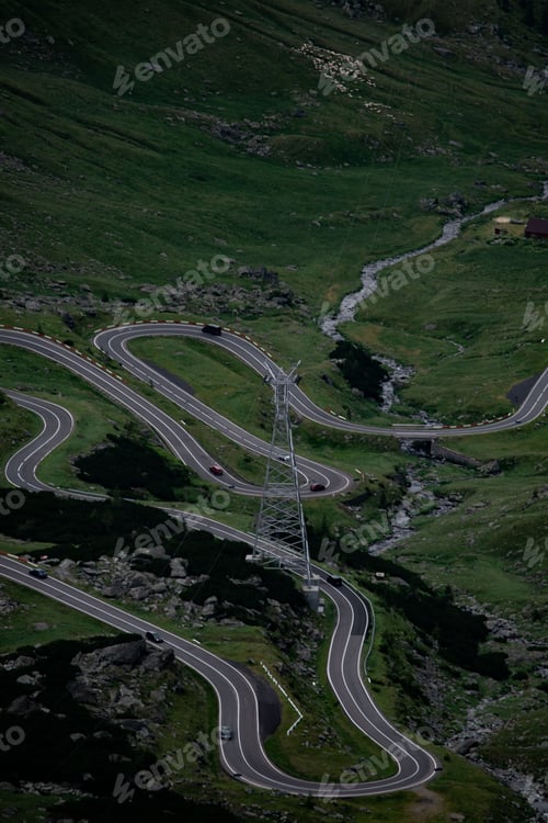 Preview: Aerial view of the winding Transfagarasan road on the green hillside