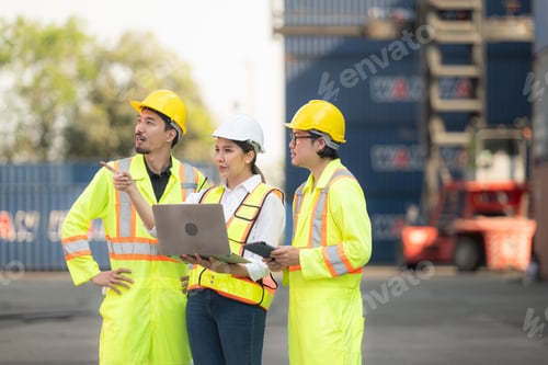 Preview: Group of engineers working with laptop in the container yard.