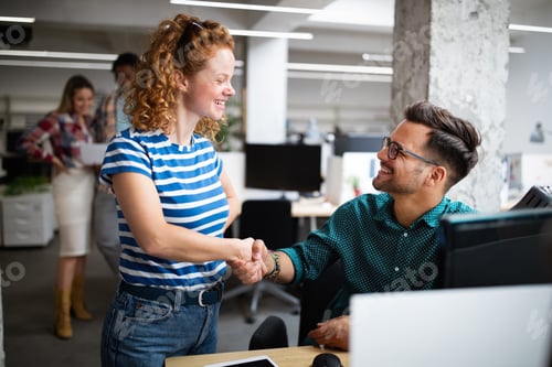 Preview: Programmers cooperating at IT company developing apps