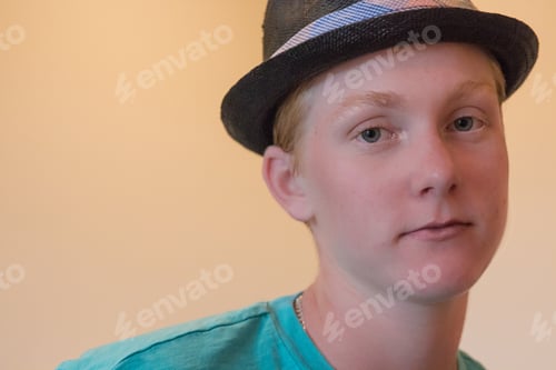Preview: Closeup of a cute boy wearing a black hat