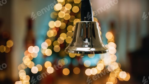 Preview: Shaking and ringing bell with blurred Christmas background