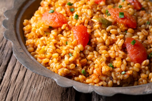 Preview: Traditional turkish bulgur pilaf with tomato sause in plate (Turkish name; meyhane pilavi)