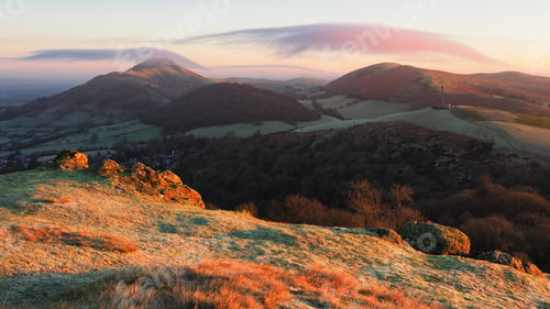 Preview: Landscape view of Caer Caradoc, Shropshire, England during sunset