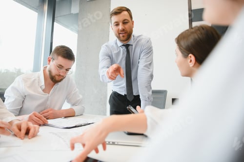 Preview: Corporate business team and manager in a meeting room at modern office with panoramic windows