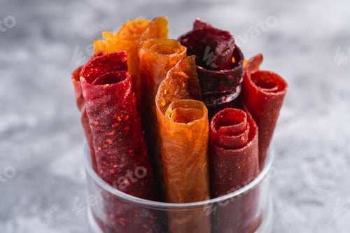 Preview: Fruit pastille in glass cup on stone concrete background
