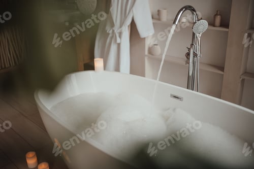 Preview: Luxury interior of big bathroom at modern african style with oval bathtub in natural lighting