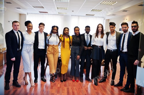 Preview: Multiracial young creative people in modern office