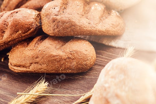 Preview: Delicious freshly bakery products on wooden background.